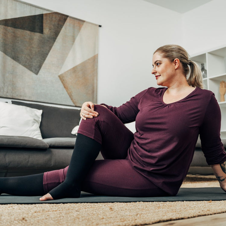 Venen Engel: Frau in Yogaübung auf Yogamatte